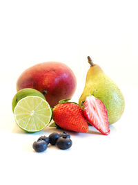 Close-up of fruit on white background