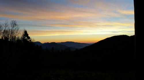 Silhouette of mountain range against sky