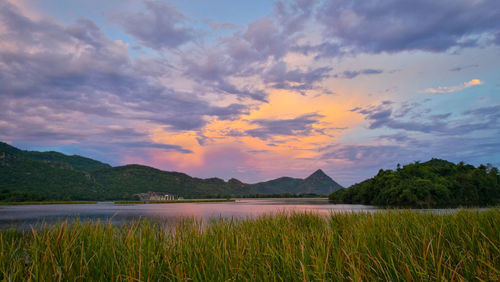Scenic view of lake against sky during sunset