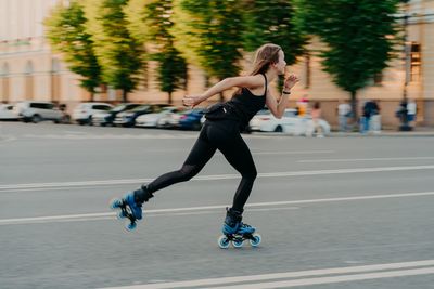 Full length of man running on road