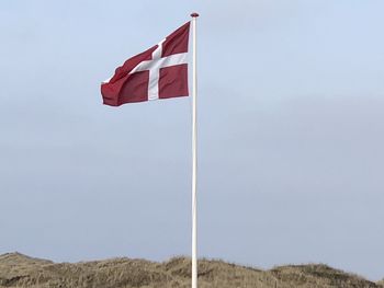 Low angle view of flag against sky
