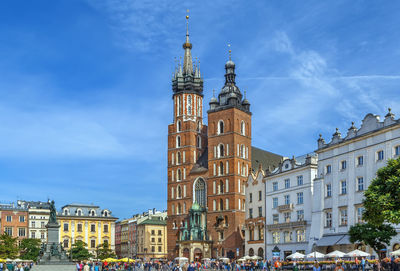 Saint mary's basilica is a brick gothic church adjacent to the main market square in kraków, poland