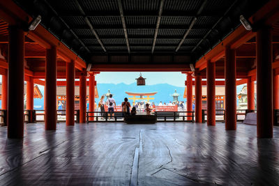People praying at itsukushima shrine