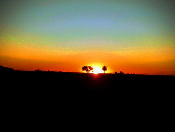 Scenic view of silhouette landscape against sky during sunset