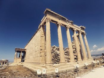 Low angle view of old temple against sky