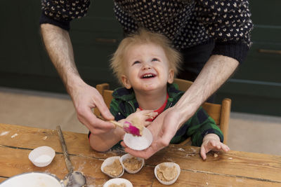 Mother and son on table