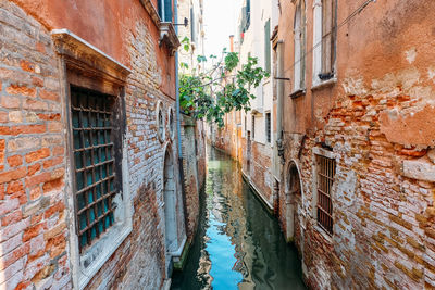 Canal amidst buildings in city