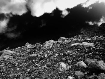 Pebbles on beach against sky