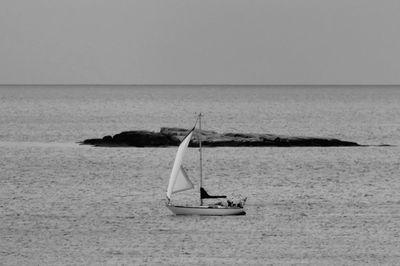 Boat on sea against clear sky