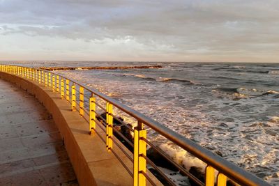Scenic view of beach against sky during sunset