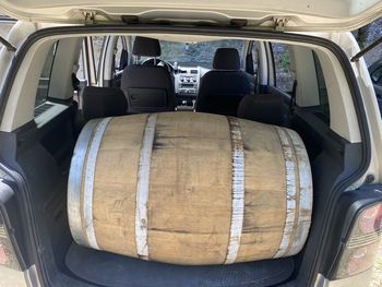 Rear view of a wine barrel in a car
