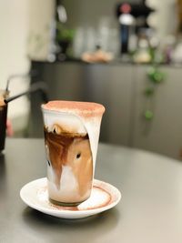 Close-up of coffee cup on table