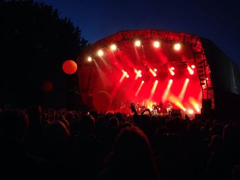 Rear view of people enjoying at concert
