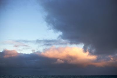 Scenic view of sea against sky at sunset