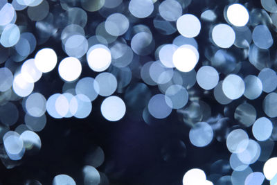 Defocused image of illuminated lights at night