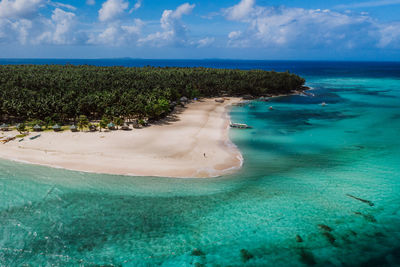 Drone view of man at beach on sunny day