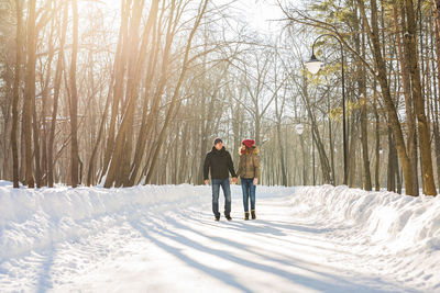 People on snow covered land