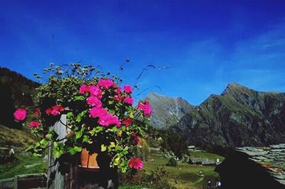 Scenic view of mountains against cloudy sky