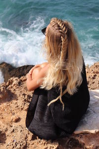 Woman sitting on beach