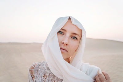 Woman wearing scarf portrait in the desert