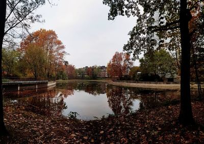 Reflection of trees in lake against sky during autumn