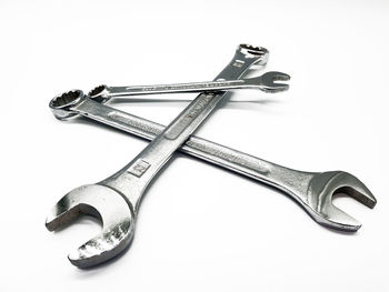 High angle view of spanners against white background