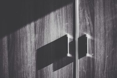 Sunlight falling on wooden closet at home