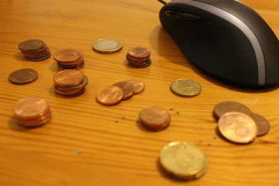 High angle view of coins on table