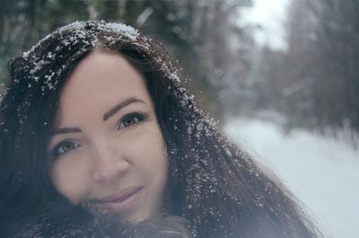 Portrait of beautiful woman with snow covered long hair