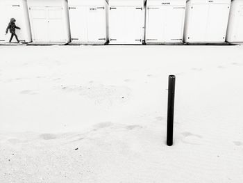 White umbrella on snow covered land