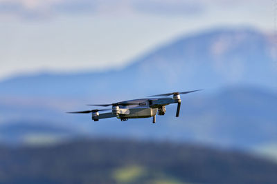 Low angle view of drone against sky