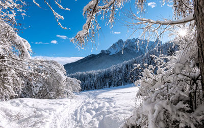 Scenic view of snow covered mountains against sky