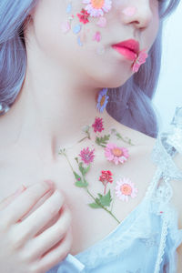 A girl's chest and flowers