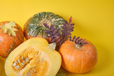 Close-up of pumpkin against orange background