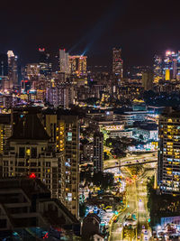 Illuminated buildings in city at night