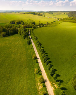 Scenic view of farm against sky