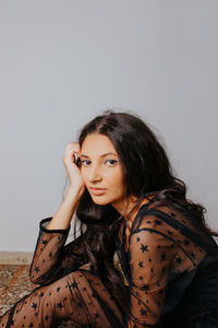 Portrait of a beautiful young woman over white background