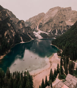 Scenic view of lake and mountains against clear sky