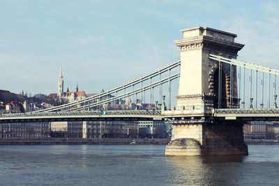 Szechenyi chain bridge over river against sky