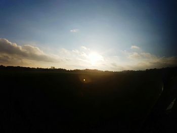 Silhouette landscape against sky during sunset