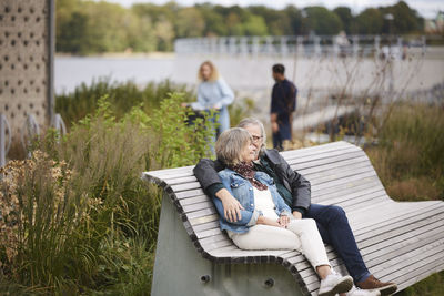 Mature couple relaxing on bench