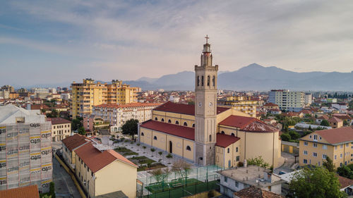 High angle view of church in city against sky