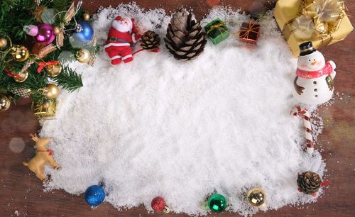 Directly above shot of christmas decorations on snow