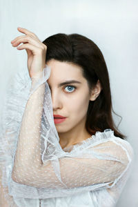 Portrait of a beautiful young woman over white background