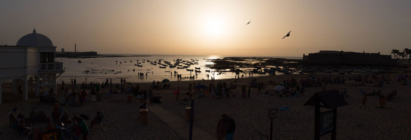 Scenic view of beach against sky during sunset