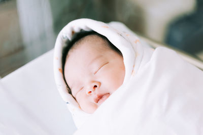 Close-up portrait of cute baby sleeping