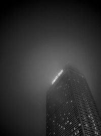 Low angle view of modern building at night