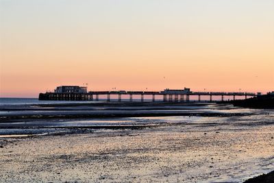 Scenic view of sea against clear sky during sunset