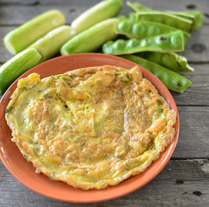 Omelet in plate on table