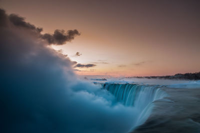 Scenic view of sea at sunset